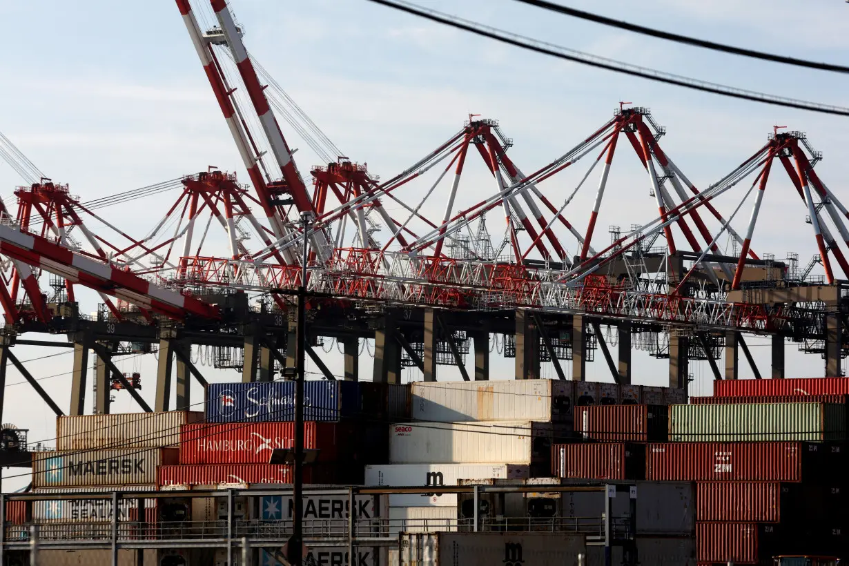 Containers and cranes are pictured after unionised dockworkers reached a tentative labour agreement in Newark