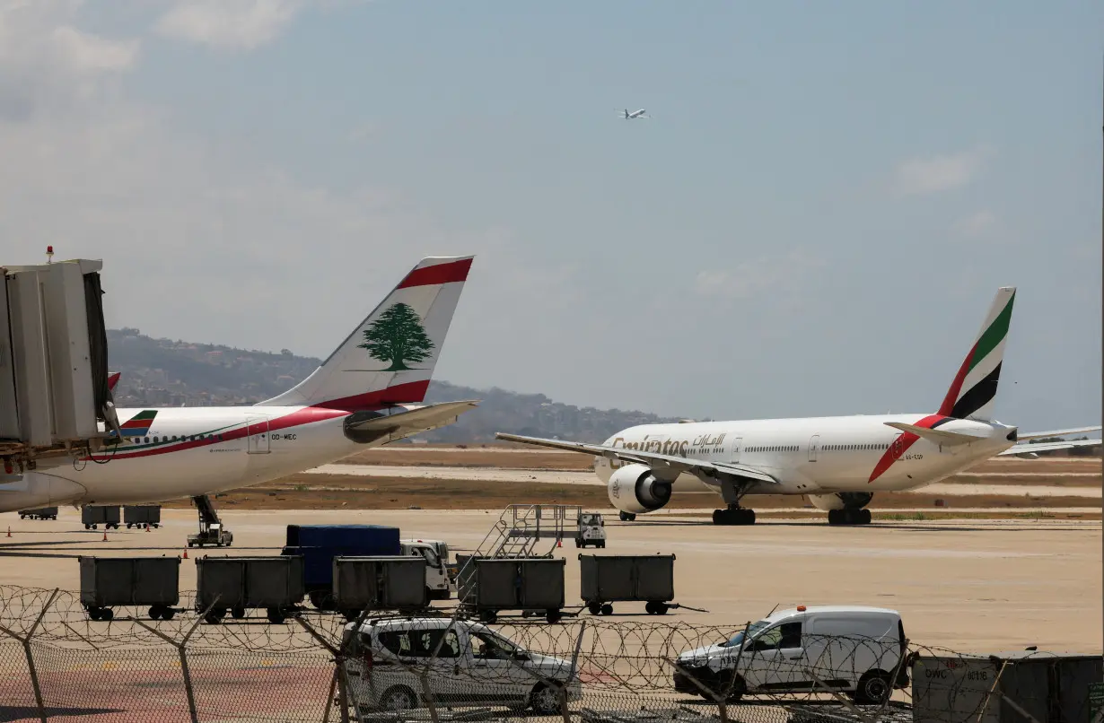 FILE PHOTO: Lebanese Middle East Airlines (MEA) and Emirates Airlines planes are pictured at the tarmac of Beirut-Rafic Al Hariri International Airport in Beirut