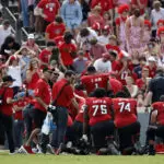 NC State QB McCall is carted off the field following a helmet-jarring hit