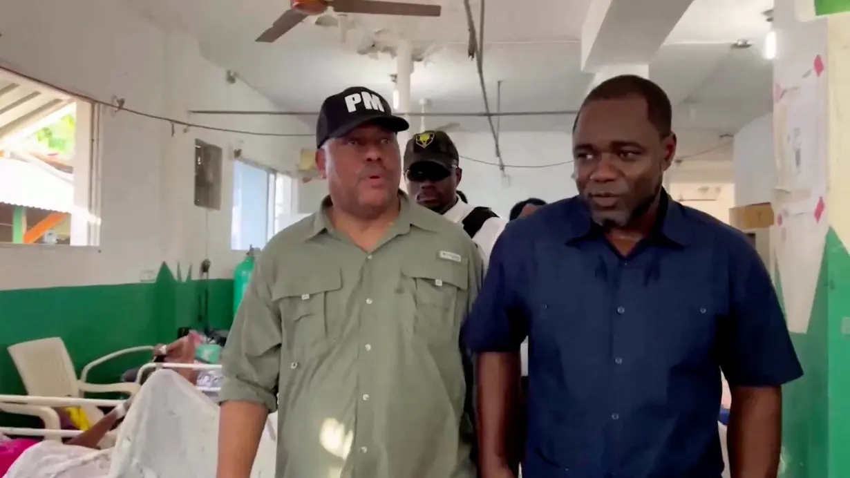 Haitian Prime Minister Garry Conille visits victims of gang attacks at a hospital, in Saint-Marc