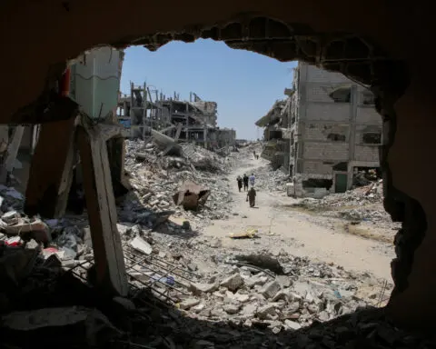 After a year of war, Gazans wonder how to deal with tonnes of rubble