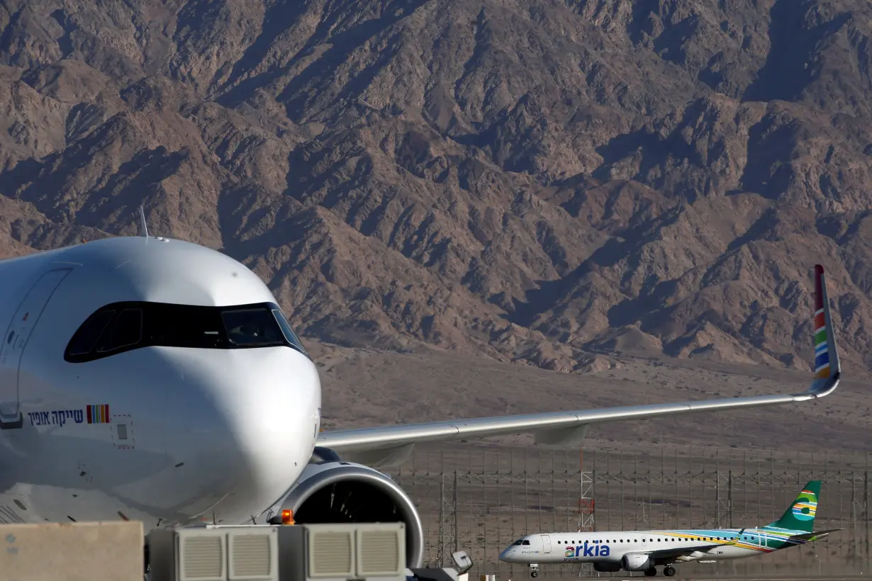 FILE PHOTO: An Arkia Israeli Airlines Embraer plane is seen in the background at Ramon International Airport