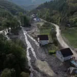 Bosnian villagers sift through ruined homes after devastating flash floods