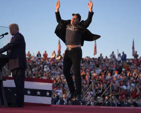 Elon Musk makes his first appearance at a Trump rally and casts the election in dire terms