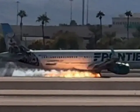 Flames seen under Frontier Airlines flight as it makes hard landing in Las Vegas