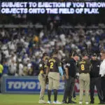 Dodger Stadium fans toss balls and trash on field, interrupt Padres' 10-2 win that evens NLDS