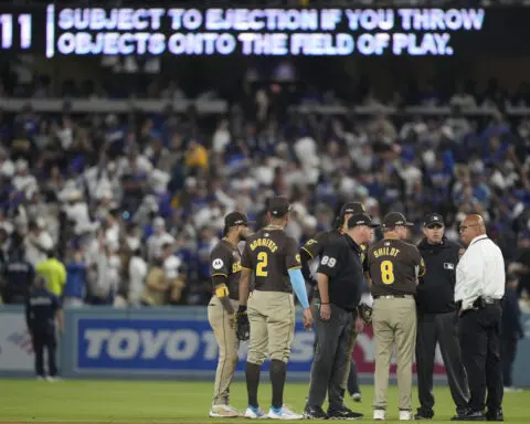 Dodger Stadium fans toss balls and trash on field, interrupt Padres' 10-2 win that evens NLDS