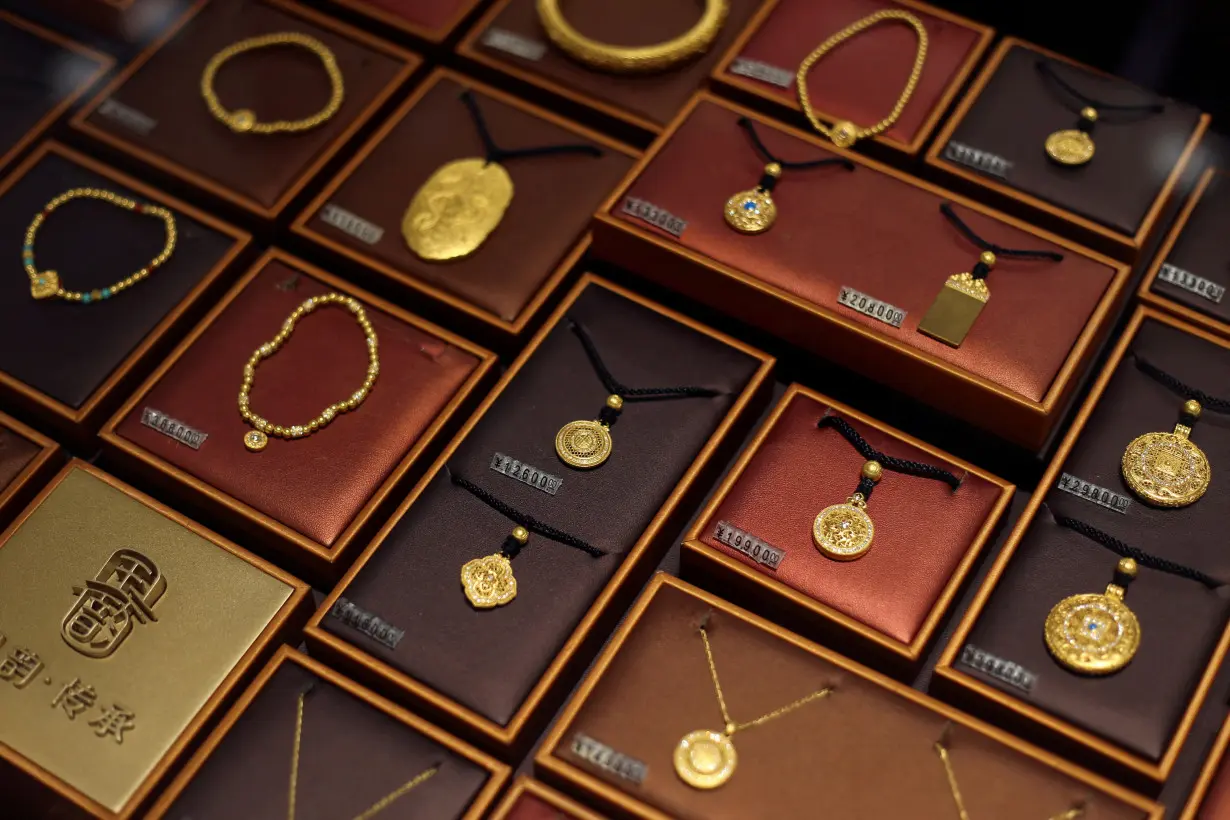 FILE PHOTO: Gold jewellery displayed for sale at Chow Tai Fook jewellery store in Shanghai