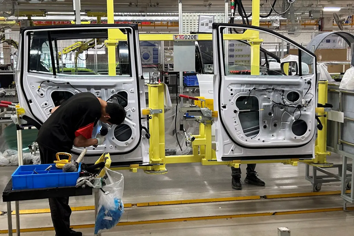 FILE PHOTO: JMEV electric vehicle production line in Nanchang