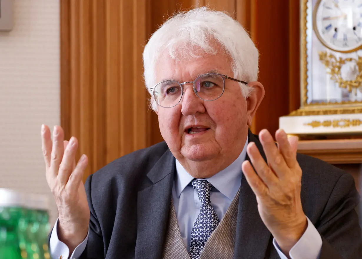 European Central Bank policymaker Robert Holzmann gestures in Vienna