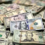 Dollar holds on to 7-week highs as traders consider US rates outlook