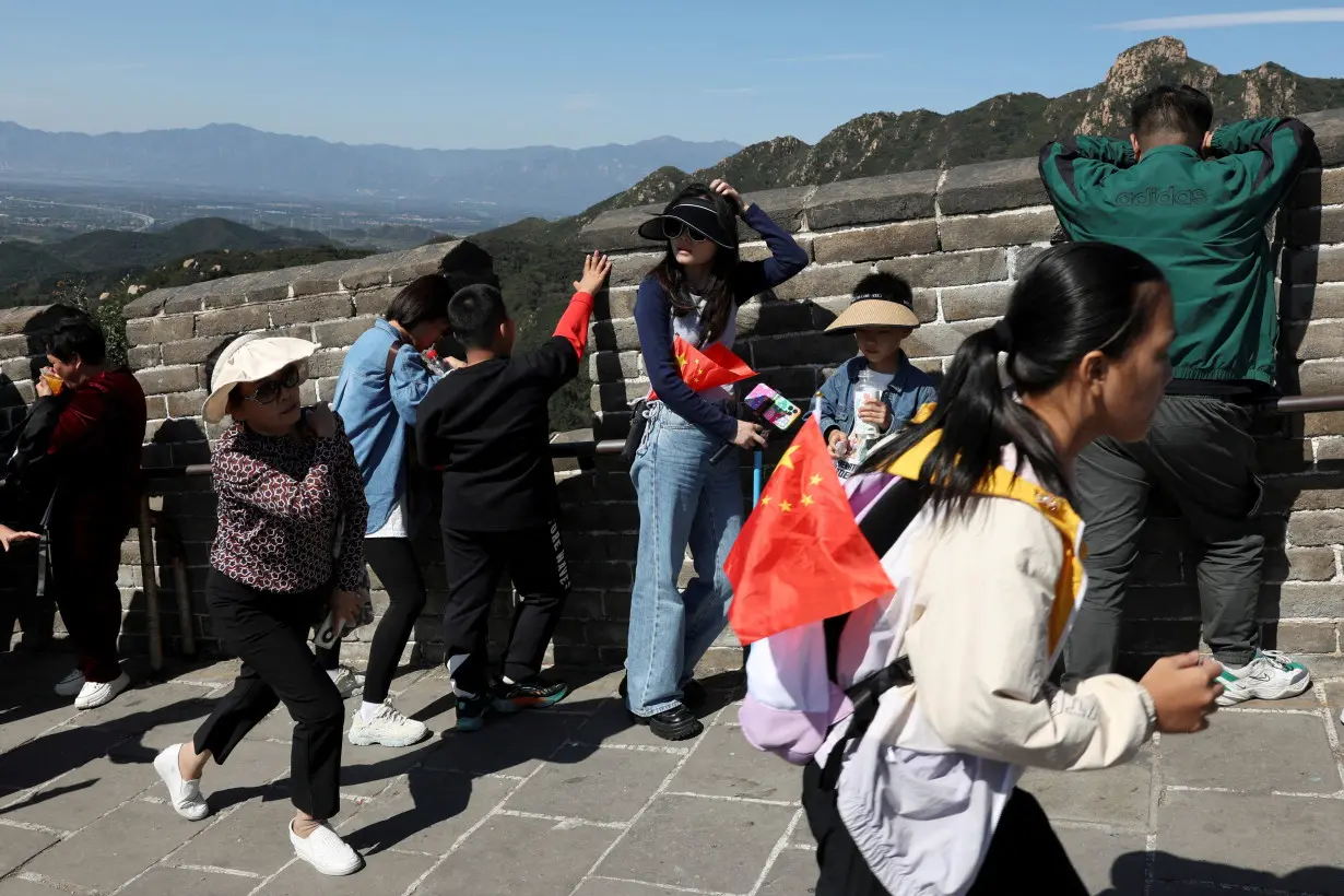 FILE PHOTO: Tourists visit the Great Wall on National Day holiday in Beijing