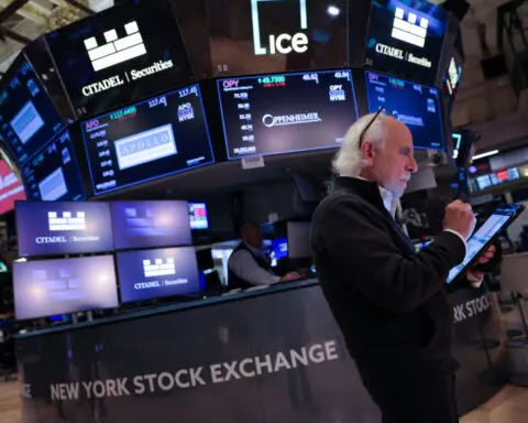 Wall Street closes higher on tech buying as investors wait on inflation data