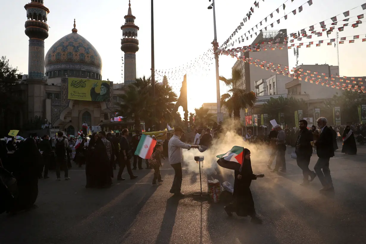 Iranians attend an anti-Israel gathering in Tehran