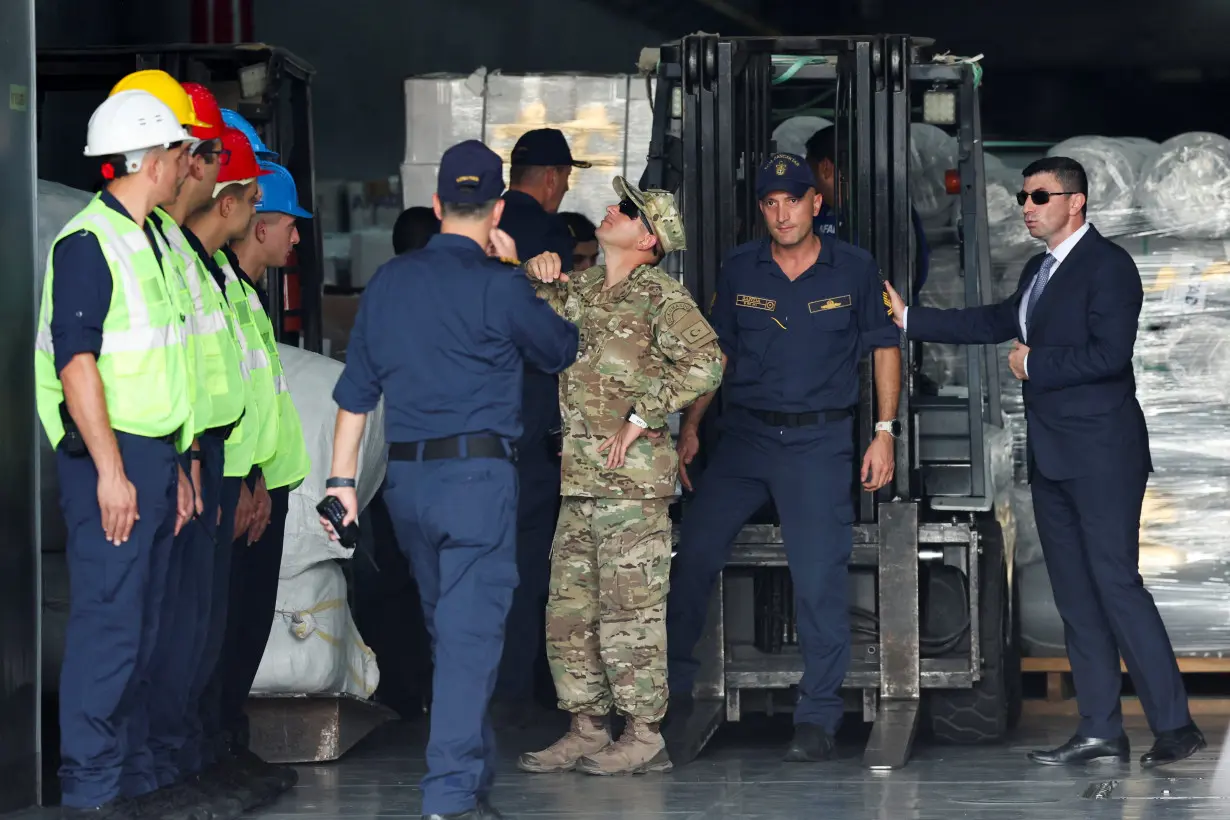 Soldiers look at a Turkish vessel at Beirut's port