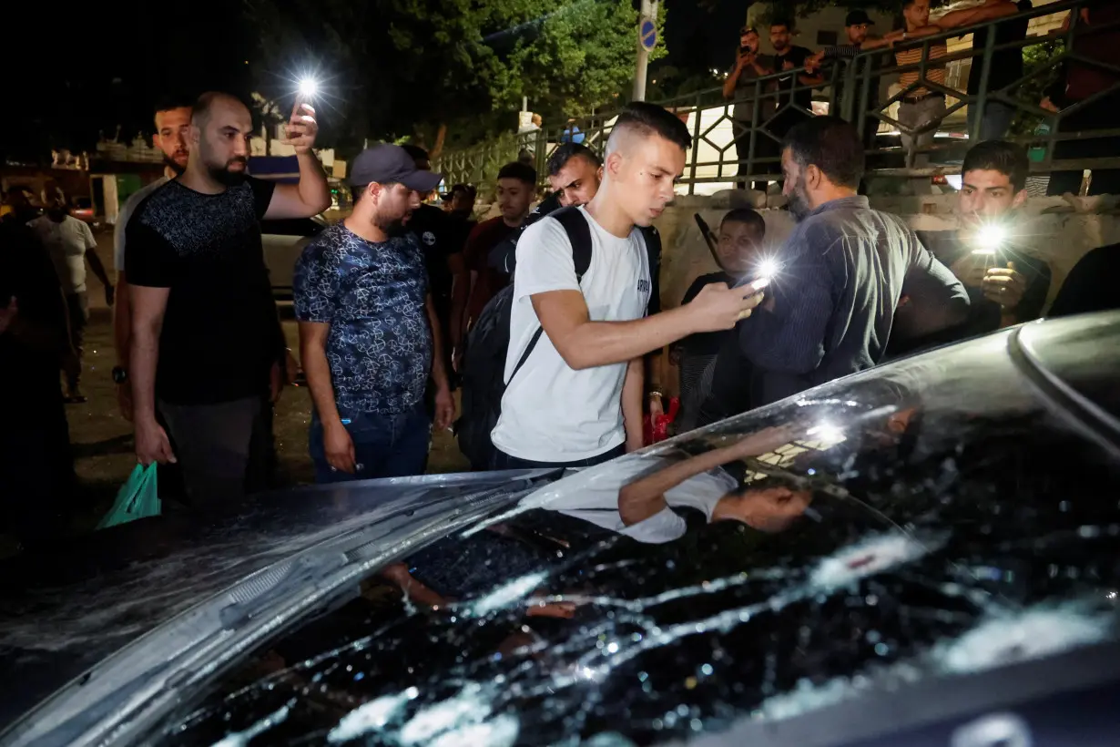 Bullet holes are seen on a vehicle, after Israeli police says forces killed Palestinian militants, in Nablus