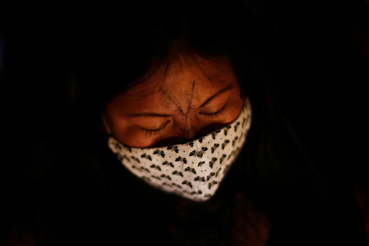 FILE PHOTO: Indigenous leader Alessandra Munduruku takes part in a protest for land demarcation and against President Jair Bolsonaro's government, in Brasilia