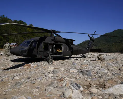 In remote mountain communities cut off by Helene, residents look to the skies for aid