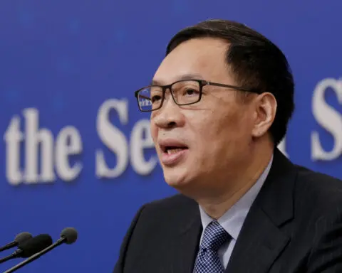 Former China deputy central bank head gets suspended death sentence for taking bribes