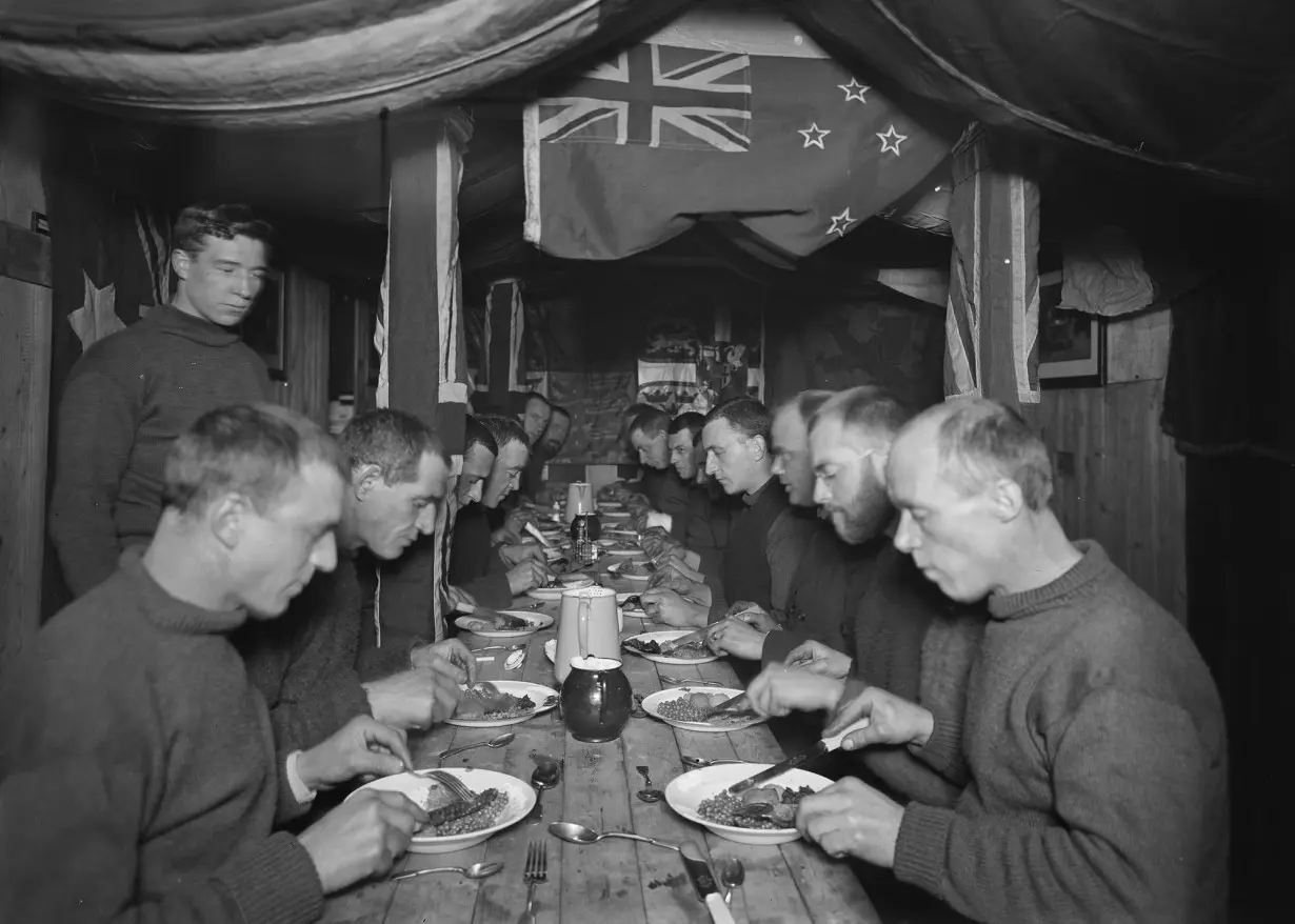 The crew of the Endurance is pictured eating a meal on board, four months before they were forced to abandon ship.