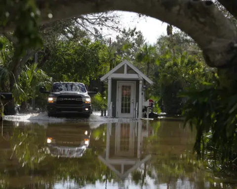 The Latest: Residents begin repairing damage from Hurricane Milton, which killed at least 10