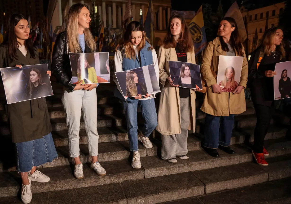 People take part in commemoration rally for Ukrainian journalist Roshchyna, who died in Russian captivity, in Kyiv