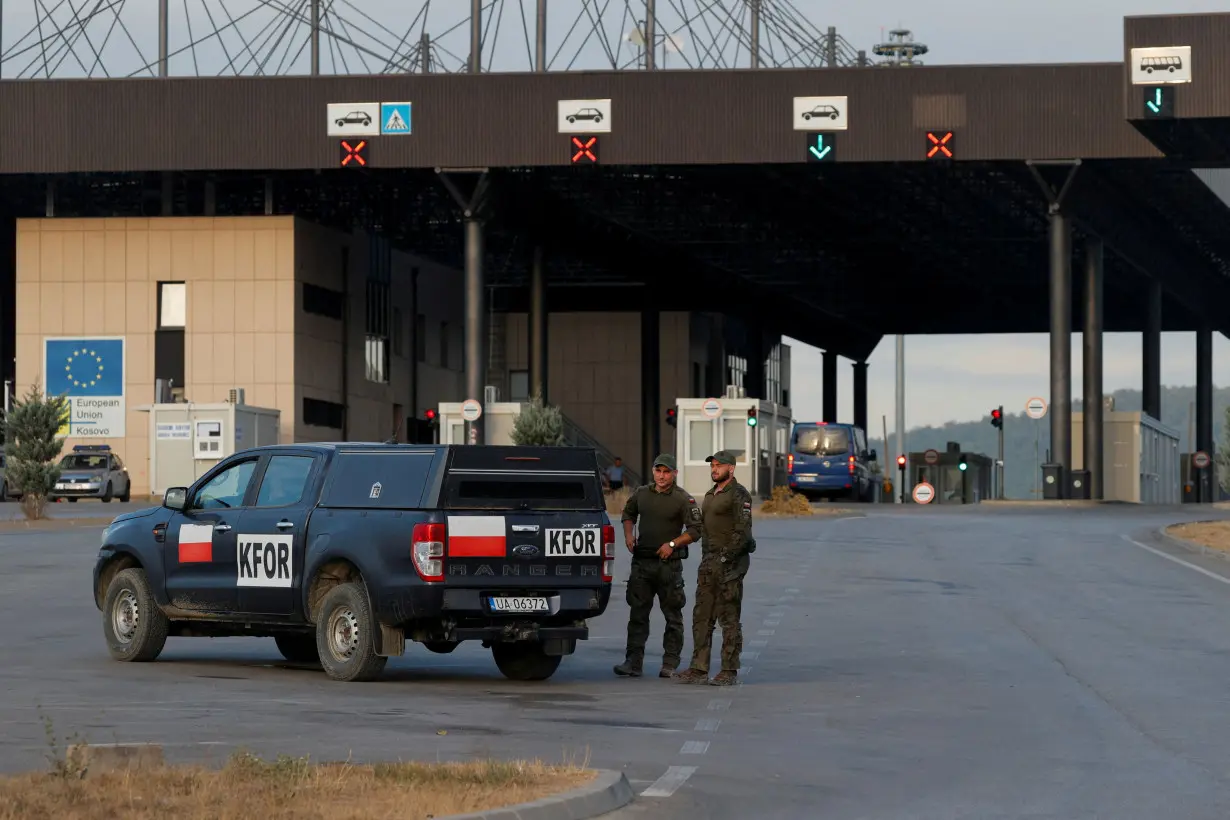 FILE PHOTO: Polish soldiers part of the NATO-led peacekeeping mission stand as they monitor the main Kosovo-Serbia border crossing in Merdare