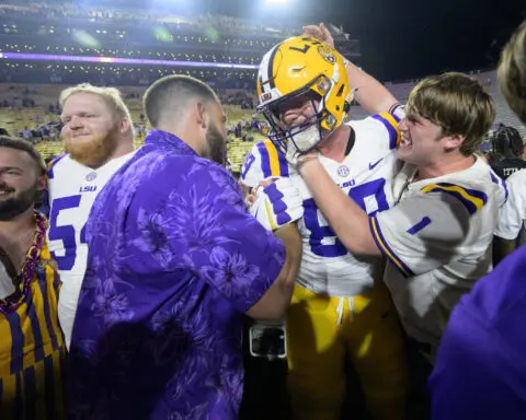 Nussmeier throws late TD passes, No. 13 LSU rallies to beat No. 9 Ole Miss 29-26 in overtime