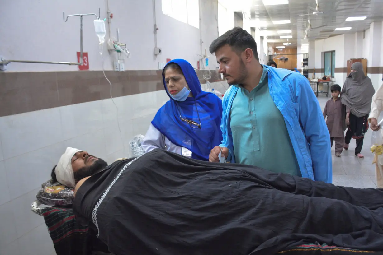 A labourer, who along with others was injured after gunmen attacked a cluster of small private coal mines, receives medical assistance in the Trauma Centre at the Civil Hospital in Quetta