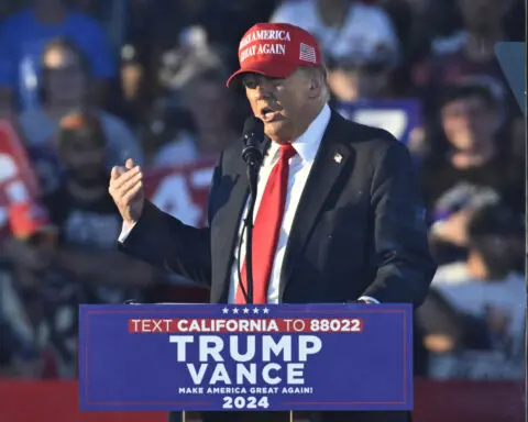 Trump suggests a protester may get 'the hell knocked out of her' by her parents