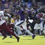 Jackson outduels Daniels and Henry runs for two TDs as Ravens beat Commanders 30-23