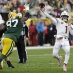 Doubs catches 2 TD passes in his return from a suspension to help Packers rout Cardinals 34-13