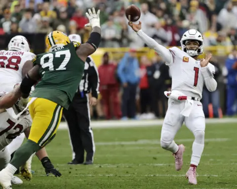 Doubs catches 2 TD passes in his return from a suspension to help Packers rout Cardinals 34-13