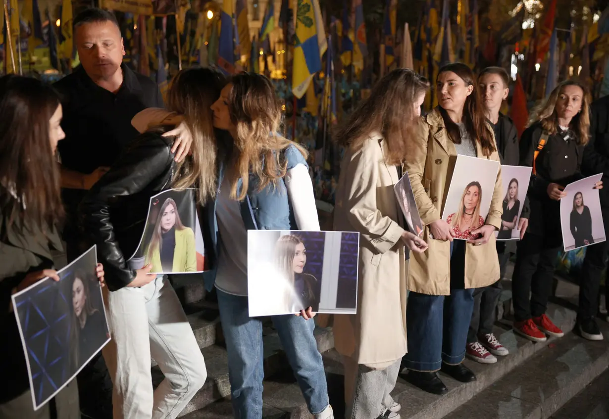 Roshchyna's colleagues gather at a memorial event in Kyiv, on October 11.