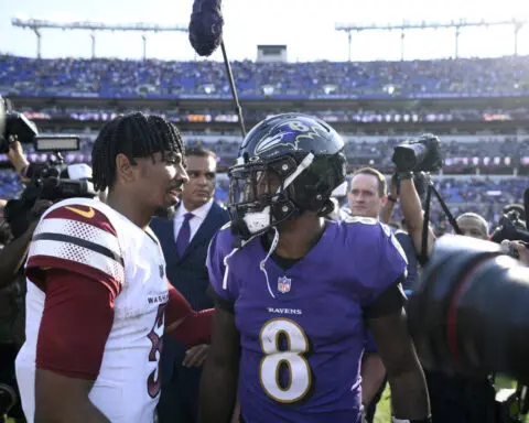 Jackson outduels Daniels and Henry runs for two TDs as Ravens beat Commanders 30-23