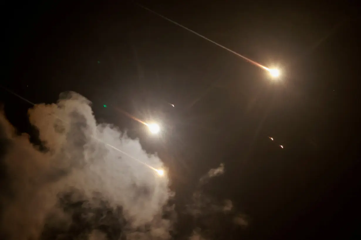 FILE PHOTO: Projectiles are seen in the sky after Iran fired a salvo of ballistic missiles, amid cross-border hostilities between Hezbollah and Israel, as seen from Tel Aviv