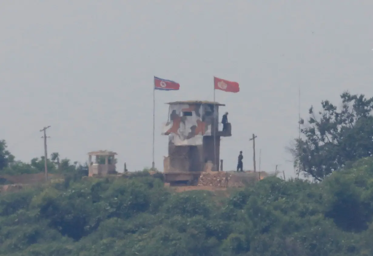 FILE PHOTO: North Korean soldiers are seen at their guard post inside North Korean territory, in this picture taken from Paju, South Korea, near the demilitarized zone (DMZ) separating the two Koreas