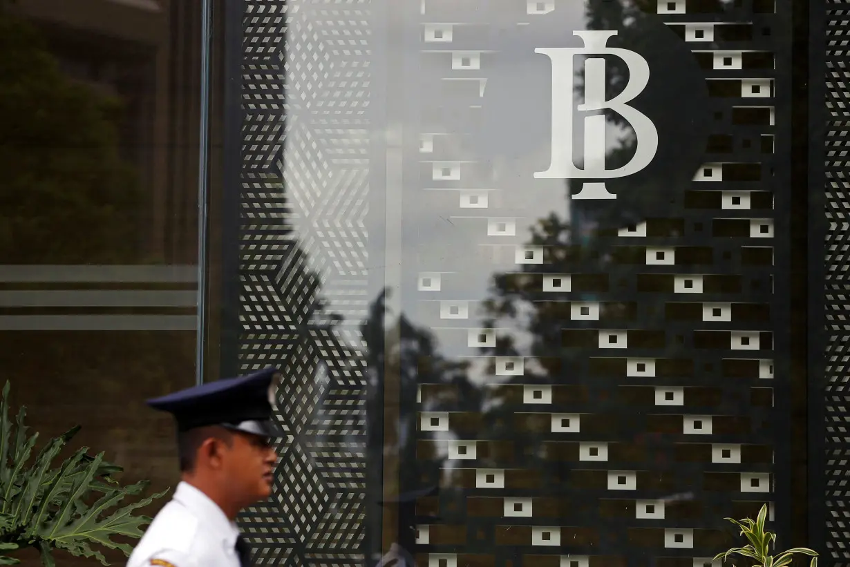 FILE PHOTO: Security member walks as he patrols at Bank Indonesia headquarters in Jakarta