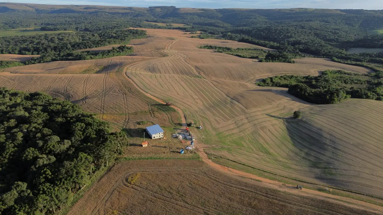 FILE PHOTO: Soybeans are harvested from a field in Ponta Grossa