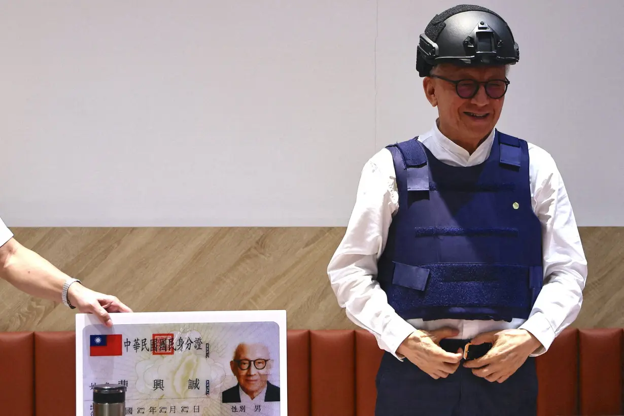 FILE PHOTO: Robert Tsao, the former chairman of contract microchip maker UMC, poses for photos at a news conference where he announces his plans to fund civil defense education in Taipei