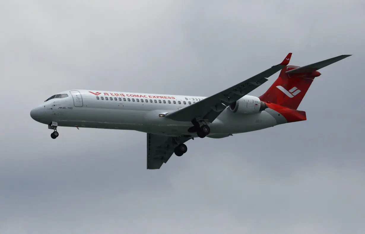 FILE PHOTO: A Comac ARJ21 flies during the aerial display at the Singapore Airshow