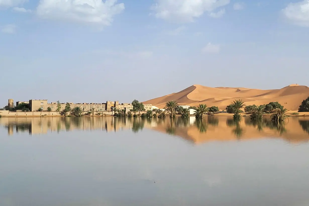 Buildings along a lake filled by heavy rainfall are pictured in the desert town of Merzouga on October 2.