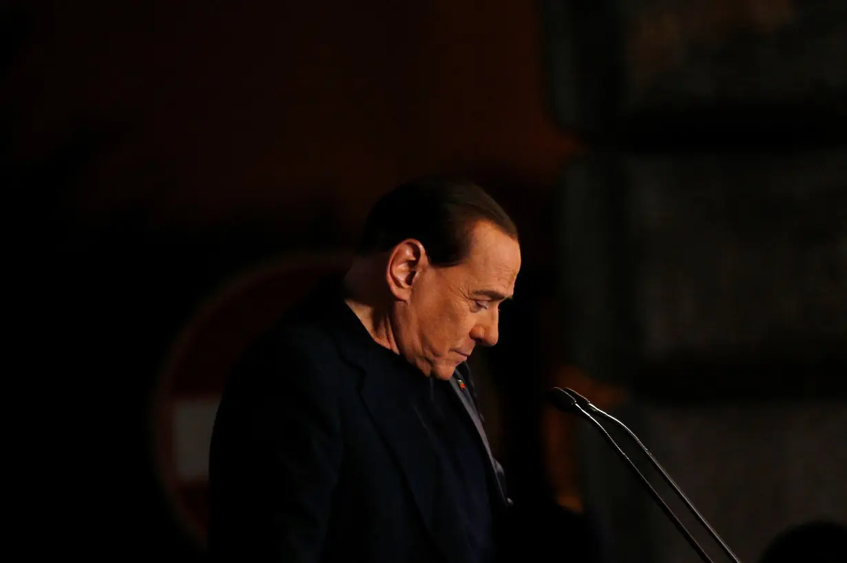 FILE PHOTO: Former Prime Minister Silvio Berlusconi delivers a speech from the stage in downtown Rome