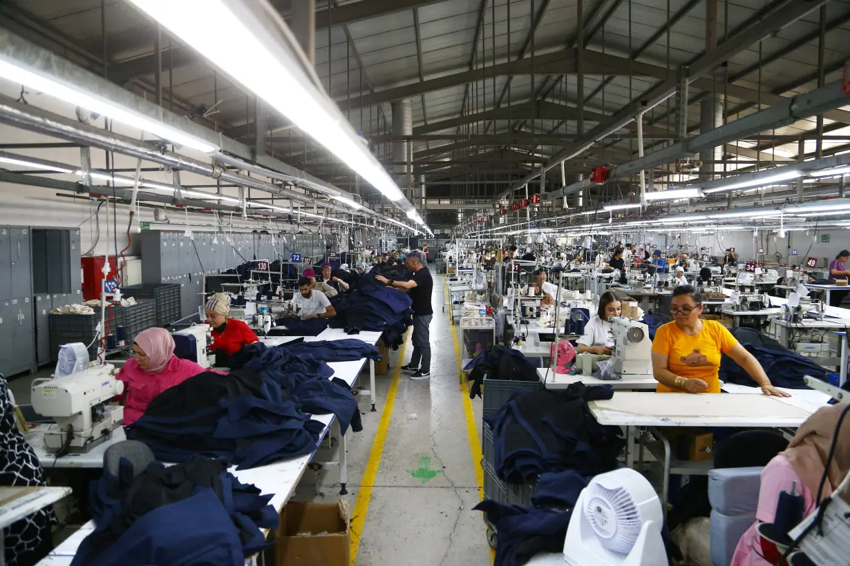 Employees work at a garment factory, in Corum