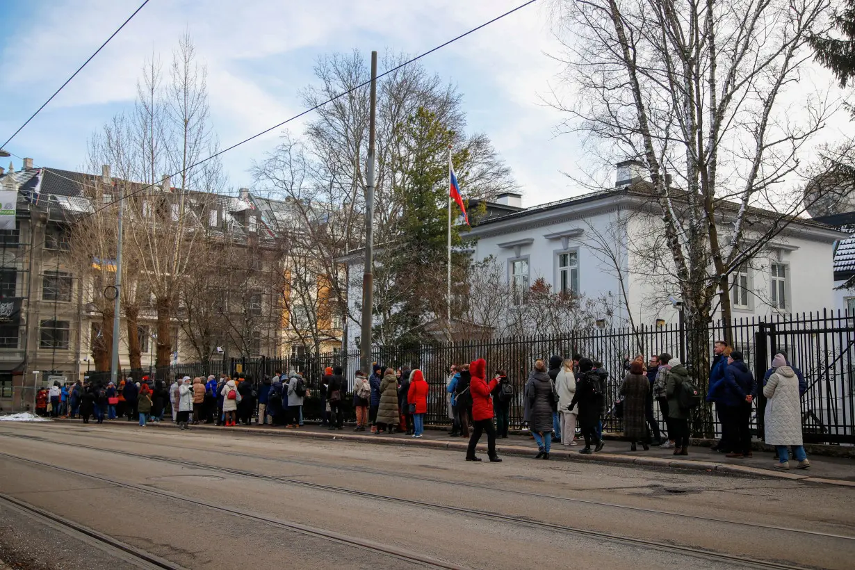 FILE PHOTO: Russians stand in a queue to vote, outside the Russian embassy in Oslo