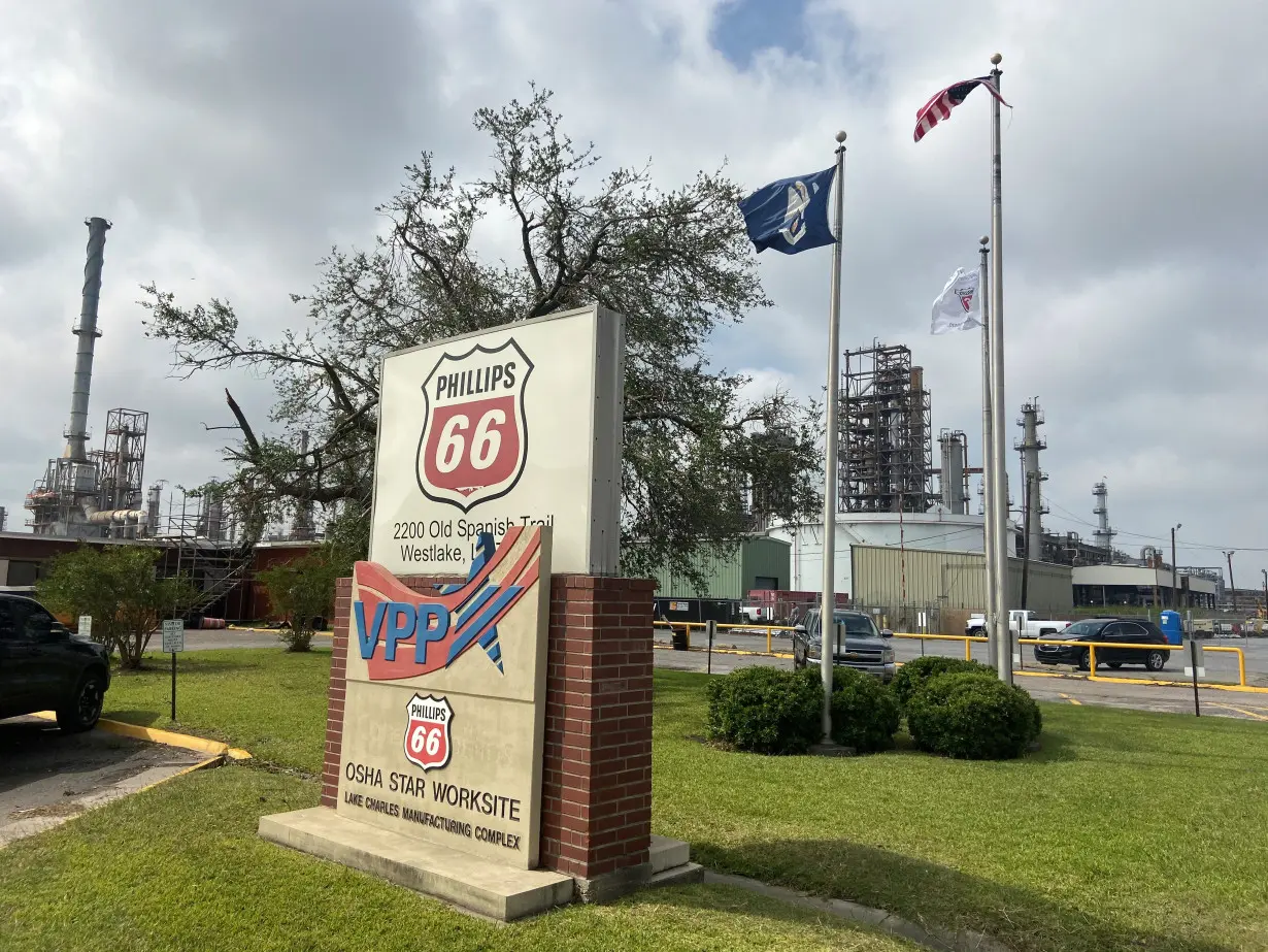 Flags wave in front of the Phillips 66 refinery near Lake Charles, Louisiana