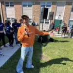 Pharrell makes surprise stop at LEGO and sneaker giveaway in former neighborhood