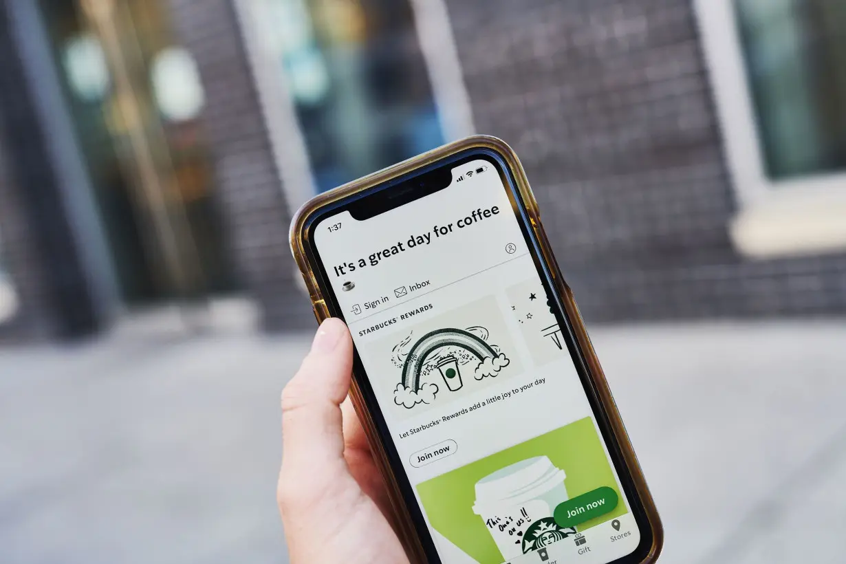 The home screen for the Starbucks app is displayed on a smartphone in an arranged photograph taken in the Brooklyn borough of New York on June 10, 2020.