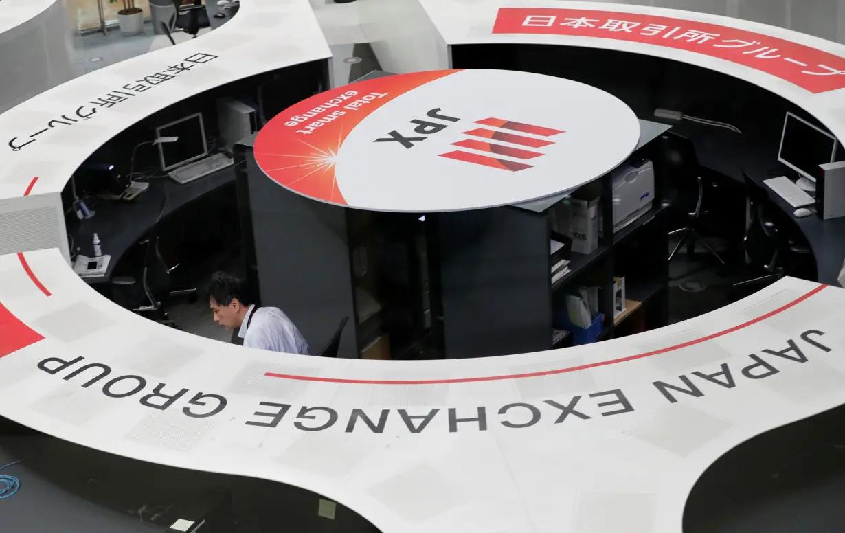 A man works at the Tokyo Stock Exchange after market opens in Tokyo