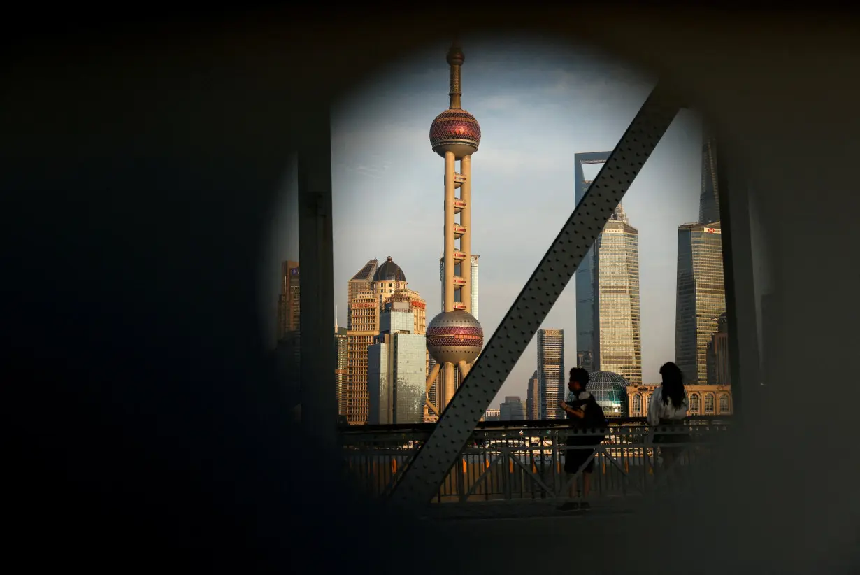 A view of the financial district of Pudong is seen on a bridge in Shanghai